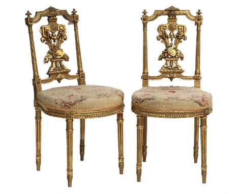 A Pair of Late 19th Century Giltwood Side Chairs, labelled Le Garde Meuble Public, Bedel &amp; Co, numbered 12730, covered in