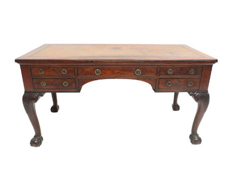 Holland &amp; Sons: A Victorian Carved-Mahogany Library Writing Table, 2nd half 19th century, the moulded top with later inse