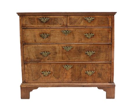 A George II Walnut and Featherbanded Oak-Sided Straight-Front Chest of Drawers, 2nd quarter 18th century, the crossbanded top