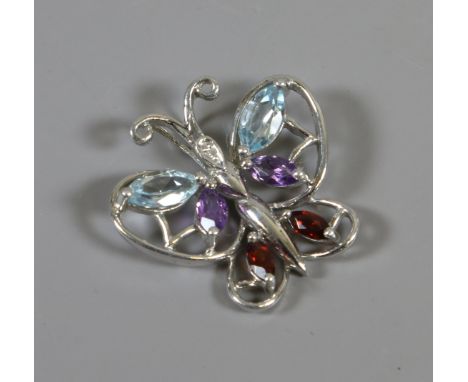 A silver openwork butterfly pendant set with diamond, topaz, amethyst and garnet.