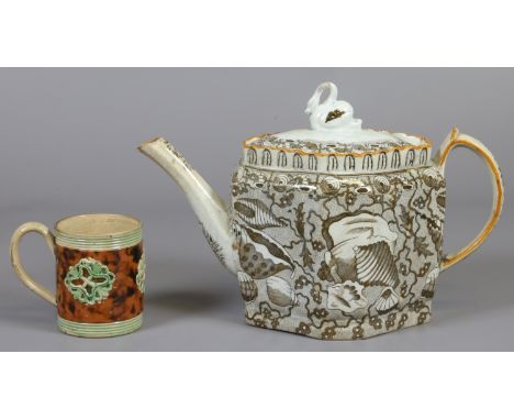 A 19th century English pottery teapot and cover of lozenge form, with swan finial and printed with shells, along with a Whiel