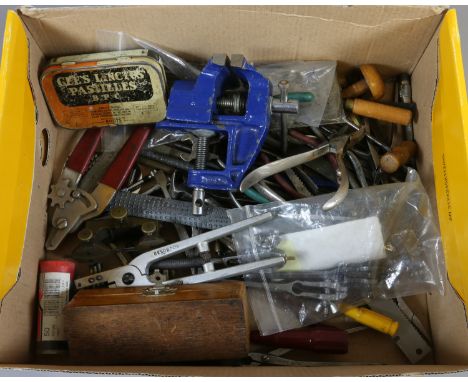 A box of assorted watchmakers tools.