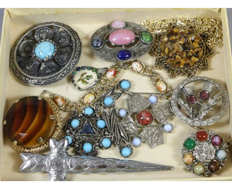 A box of vintage costume jewellery including Scottish hardstone Celtic style brooches.