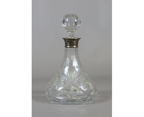 A cut glass ships decanter with silver collar by Mappin & Webb, assayed London 1971.