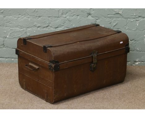 A metal travel trunk with twin handles.