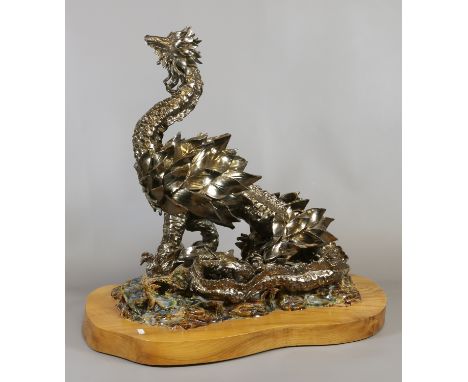 Val Lister as exhibited in Alexander Palace a very large copper lustre glazed ceramic sculpture of a dragon raised on rockwor