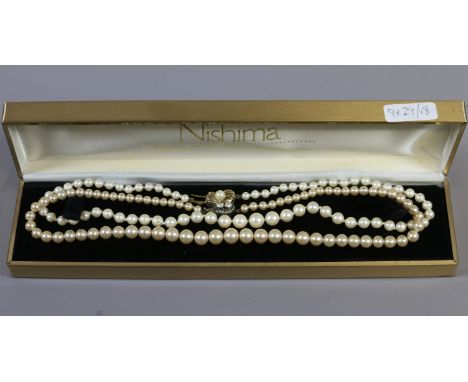 Two simulated pearl necklaces, one with silver gilt clasp the other silver and paste.
