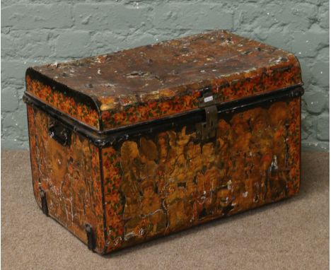 A painted tin travel trunk with decoupage decoration.