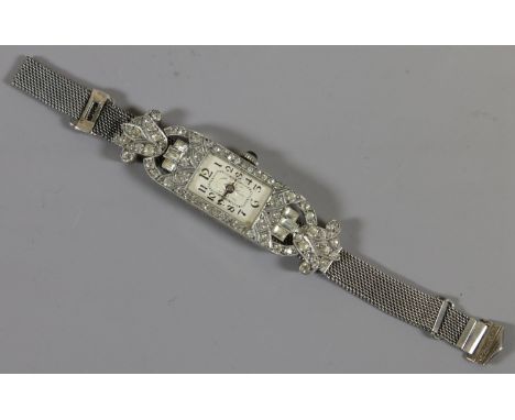 A ladies Art Deco white metal paste set manual cocktail watch.    Condition Report. To be used as a guide only.  Running. Adj