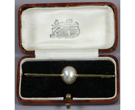 A cased 15ct gold bar brooch set with a large mabe pearl.