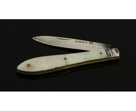A mother of pearl hafted pocket knife with white metal blade marks rubbed.