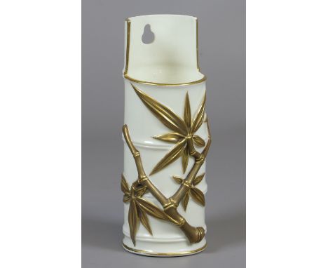 A Royal Worcester Aesthetic period wall mounting vase. Moulded in the form of a bamboo section further ornamented in relief w