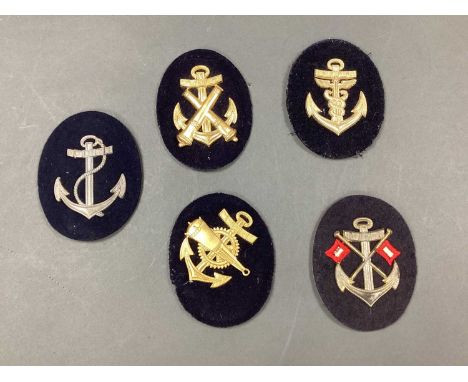 WWII German Third Reich Kriegsmarine Career Metal on Cloth Insignia, including signals and ordnance (5).