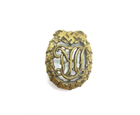 WWII Third Reich German National Sports Badge in bronze, maker marks on reverse 'Wernstein Jena' and 'DRGM 35269'.