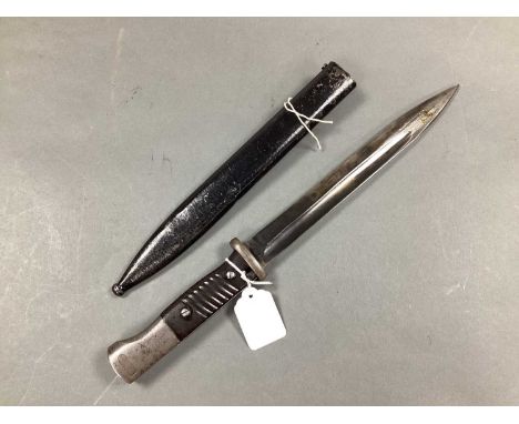 WWII Third Reich German K98 Bayonet and Scabbard, bayonet manufacturer mark 'Fuj' and year '43', some surface damage to grip.