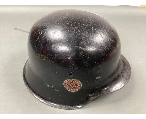 WWII German Third Reich M42 Helmet, black paint finish to exterior and green paint finish to interior; service decal to side 