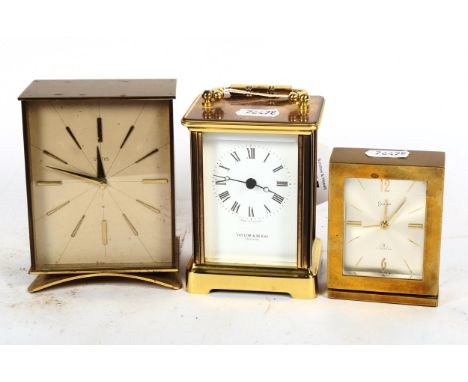 A brass carriage clock with quartz movement, and 2 other brass clocks 
