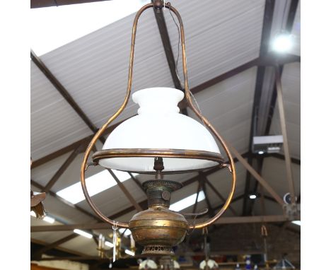 A brass ceiling oil lamp converted to electric, with milk glass shade, height 85cm, and another ceiling light fitting (2) 