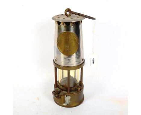 A silver plated brass Protector Lamp &amp; Lighting Co Ltd miner's lamp, height 23cm 