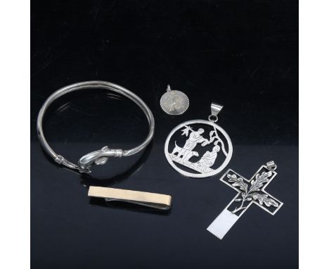 A sterling silver dolphin design bangle, crucifix pendants etc 