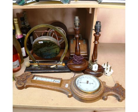 An oak barometer, a gong, height 31cm, oak table lamps, coal scuttle design cabinet, clock, and a tea tray 