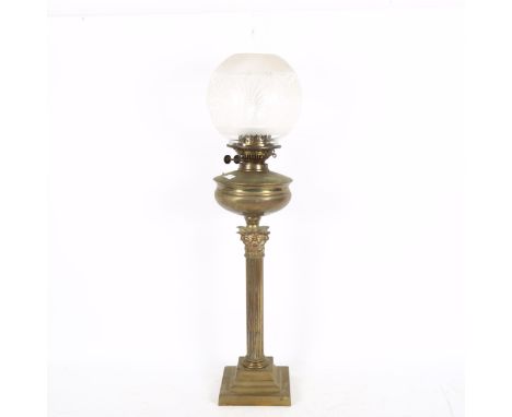 An early 20th century Duplex brass Corinthian column oil lamp, with glass funnel and shade, height 80cm 