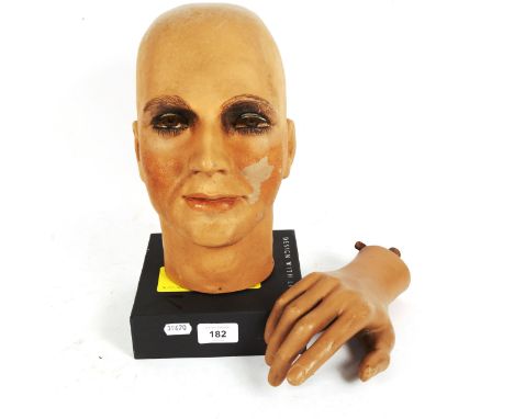 A hand painted composition mannequin head, by Sperling Models Ltd, and a mannequin hand 
