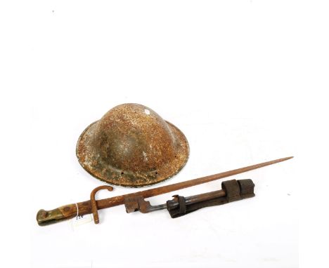 A bayonet in scabbard, and another, length 62cm, and an Army tin helmet 