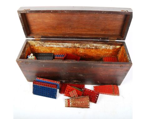 A stained pine chest, containing Vintage Meccano 