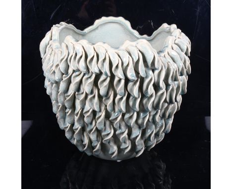 An Oriental glazed ceramic pot with applied leaves, height 27cm 
