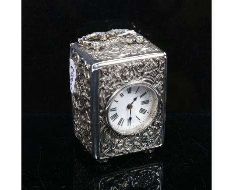 An Elizabeth II embossed silver-cased carriage clock, white enamel dial and Roman numerals, London 1956 