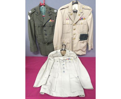 Three American Uniforms consisting light khaki, service dress tunic. &nbsp;Inspector General collar badges. &nbsp;Major rank.