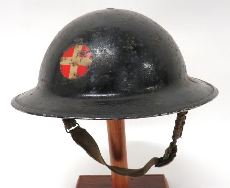 WW2 Home Front Medical Service Helmet black painted shell. &nbsp;The front with transfer red circle with central white cross.