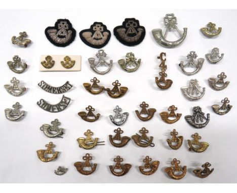 39 x Various Light Infantry Shoulder Titles/Collars including brass C4 over bugle ... Chrome Somerset with bugle ... White me