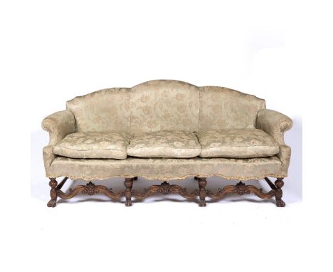 Walnut Carolean style sofa with carved and shaped frame and with loose cushions, 208cm across, 83cm deep, 96cm high (On-line 