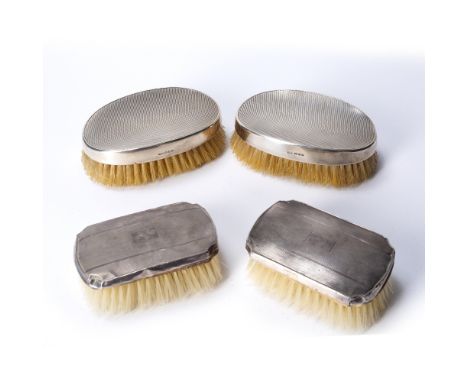 Two pairs of silver backed brushes both with engine turned decoration and indistinct marks (4)