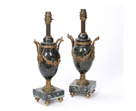 Pair of marble urns French, with applied ormolu mounts to the body, supported by four raised feet, later converted to a lamp,
