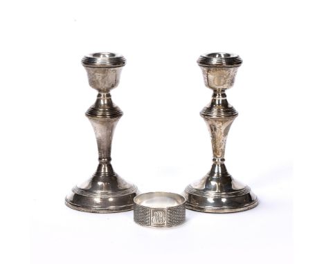 Pair of silver candlesticks with loaded bases, bearing marks for W I Broadway &amp; Co, Birmingham, 1969, 14cm high and a sil