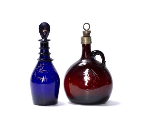 Bristol blue decanter and stopper with gold gilt lettering for brandy, 22.5cm high, together with a ruby red decanter and sto