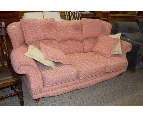Modern three seater sofa on turned legs 