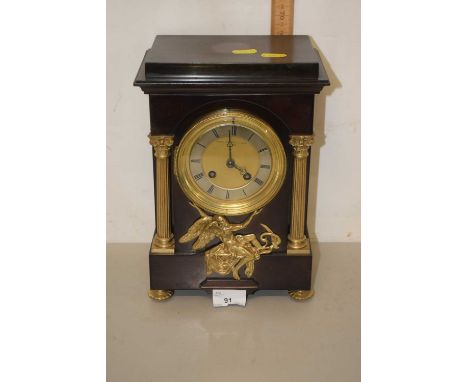 Depree Raeburn &amp; Young Exeter, early 20th Century mantel clock set in a sheet metal case with bronzed finish and brass pi