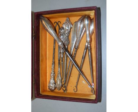 Case of assorted button hooks