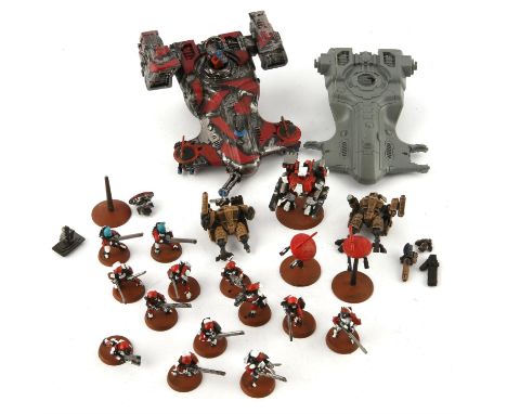 Tau Empire. Warhammer 40,000 for Games Workshop. A collection of painted and unpainted plastic Tau models for Warhammer 40k. 