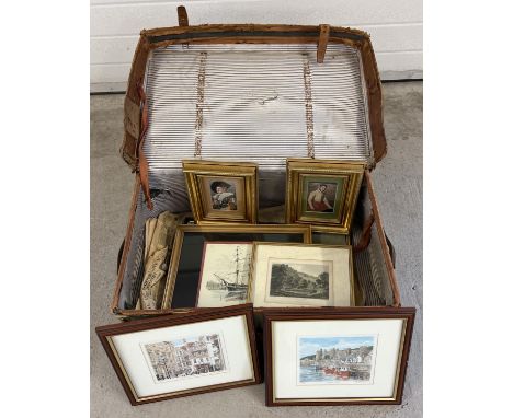 A vintage leather traveling trunk containing a collection of assorted pictures. To include etchings, limited edition prints &