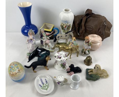 A box of assorted misc items to include Poole pottery dolphin, brass horse figure, resin dog ornaments and ceramic book ends.