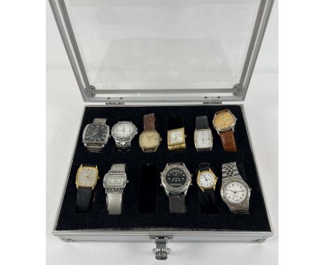 A metal and perspex watch display case containing 11 men's and women's modern wristwatches. To include Timex, Sekonda, Pulsar