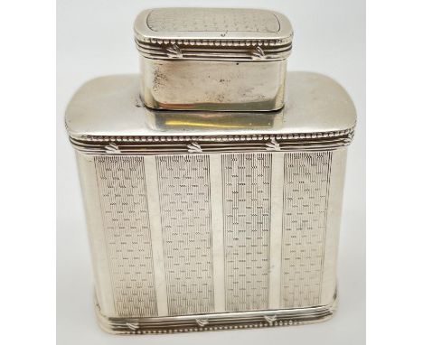 A Mappin &amp; Webb Edwardian silver tea caddy with panelled engine turned decoration. Hallmarked to underside and lid interi