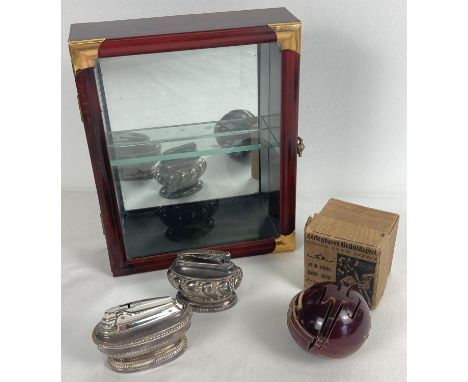 A small collection of misc. items. Comprising: a small wooden mirror backed display cabinet, 2 silver plated Ronson table lig