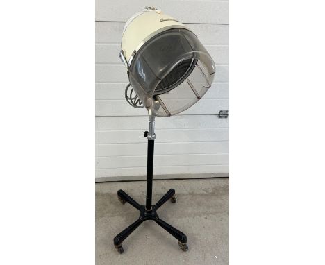 A vintage 1960's floor standing adjustable height Europa hairdryer by Eugene. On wheeled feet. 
