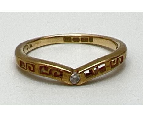 A 9ct yellow gold wishbone ring set with central diamond and with pierced work detail. Fully hallmarked inside band, ring siz